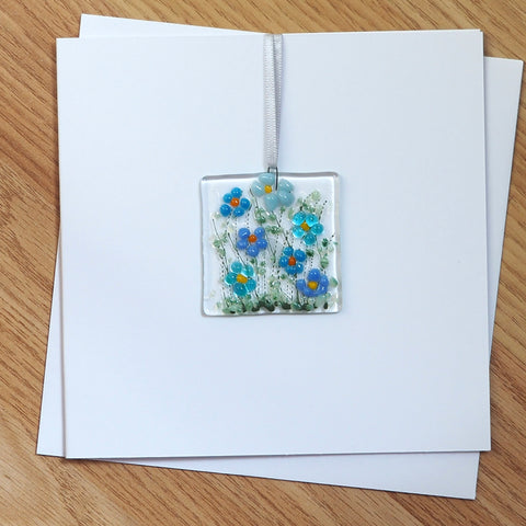 Blue daisy flowers glass greetings card