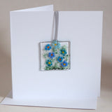 Blue daisy flowers glass greetings card