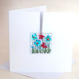 Turquoise and pink daisy flowers glass greetings card