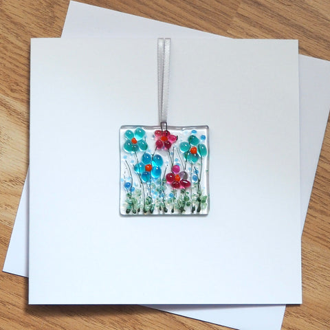 Turquoise and pink daisy flowers glass greetings card