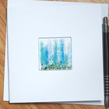 Tall blue and turquoise flowers greetings card