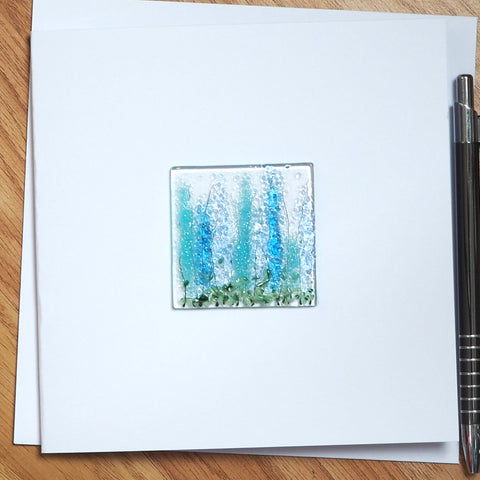 Tall blue and turquoise flowers greetings card
