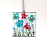 Turquoise and pink daisy flowers glass greetings card